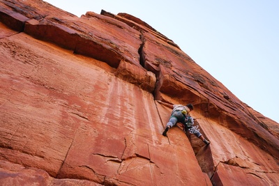 Brooks Working on the first crux during his FA of Bernie Breakdown