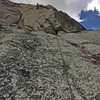 3rd pitch of the golden pillar, the route goes out right to a pin, then comes back left to a traversing finger crack with good feet below.  i found this to be the easiest of the first 4 pitches.