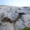 Pitch 1. We started up the corner on the left, but the actual route is the corner on the right (below Doug in the photo). Either goes at 5.9+ delicate climbing.