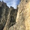 Peter getting to the belay at the bottom of pitch 4, the short traverse to the climbers left from the direct start