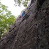 My Wife's Pajamas.  Easy climbing in the middle.  The white rock with the upper crux is visible between the leaves at the top of frame.