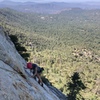 Kristen showing how low angle the traverse on P2 is, notice her gear