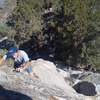 Alex near the top of Clip Art (5.10c), Onyx Summit Crag