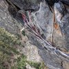 Not sure if I ended at the right spot on the top of pitch 3 but I was running low on gear so this was where I set up my anchor (two cams in a flake behind the triton rock feature protecting upward pull).