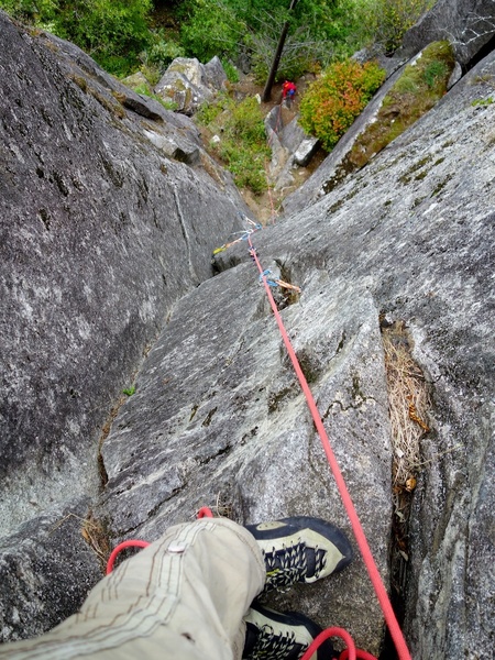 Looking down from the top of Pitch 2. The climbing is great 5.9 steep corner climbing after the vegetated adventure at the start of the pitch.