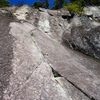 Looking up Pitch 5. Climb the tips crack and finish with a steep bolted face.