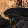 Dave Hoven rapping off the large ledge with the Dolores River in the background.