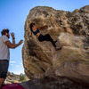 Sue working out hand beta on that sidepull and moving into the upper section.
<br>

<br>
Start hold of Joe 97 Right visible as the enormous half-hueco on the right side of the photo.
<br>

<br>
Photo by Brad Booth (I think?).