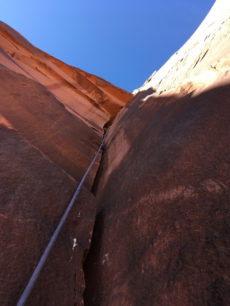 Just above the first chimney on pitch 2, looking up the wide hands