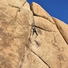 Todd susses his gear options just before the crux finish