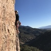 Zoe just above the crux on Muscle Beach.