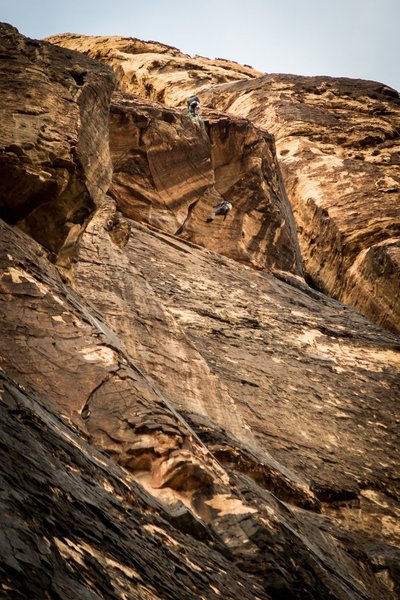 A climber swinging in space after falling off the big roof crux. December 2018.