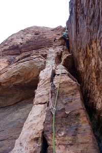 Moving up into the steep offwidth on Pitch 2. (Photo: Giselle Field)