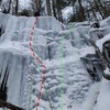 Pitch 2, the left side (red line) is WI3. Right side (green) is WI2. Rap rings were on tat on tree to the right of the boulder.