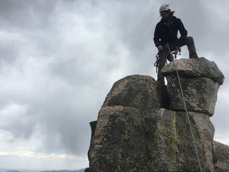 On the tippy top of the summit. The large flat ledge below is big enough to have a lay down.