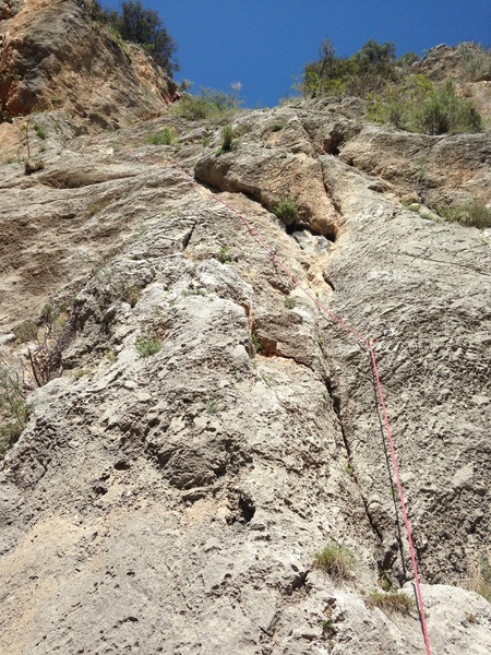 Climbing partner at the top of the second pitch of Babylon. First station is just to the left before it continues up.
<br>
Heading up straight is Etik & Pratik