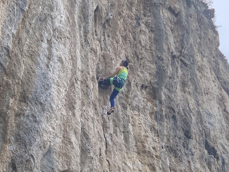 Resting on the cool semi-detached tufa before moving into the crux section