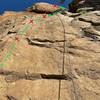 Staring up the quite smooth face of Standard Deviation. Starting with the first bolt to the left, the route heads straight up the left rope strand and takes a right near the shadow of the tree.