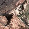 Looking down from Final Pitch, Rufus Miller on Pitch 4 belay Ledge