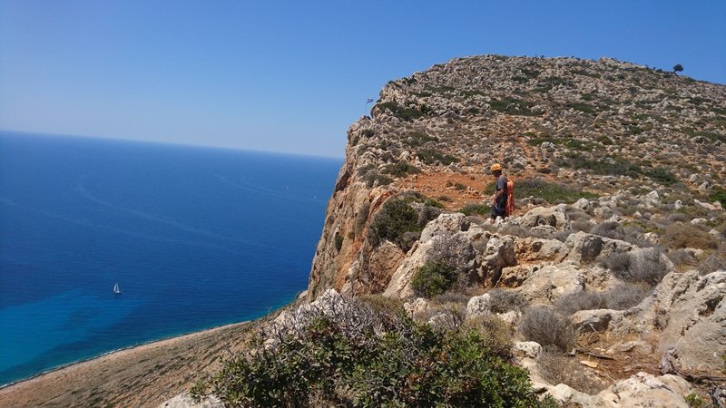 The top of the Stavros cliff.  The rappel route is supposedly before the flag.