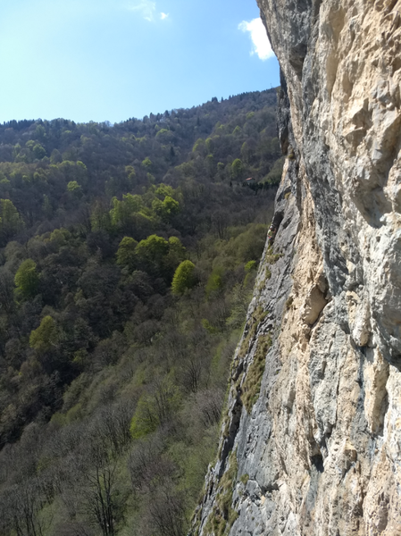 shot about 2-pitches up of the left wall - tiny climber giving thumbs up from his p2 anchor about 35m up.