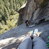 Little belay ledge just past roof section. Single rusty piton and some small cams BD ~0.4-0.75 make a decent anchor here. Short final pitch above.