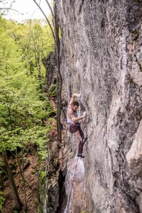 Eddie pulling the crux move on the right method.  The move involves a lot of body tension held in this very difficult gaston with high feet, then a high right hand crossover, basically diving for a good jug above.