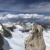 Lower eastern summit of the Petit Griffon with storm clouds building over the Owens Valley in the distance