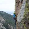 Climbing midway through the crux.
<br>

<br>
Photo credit: Kyle War.