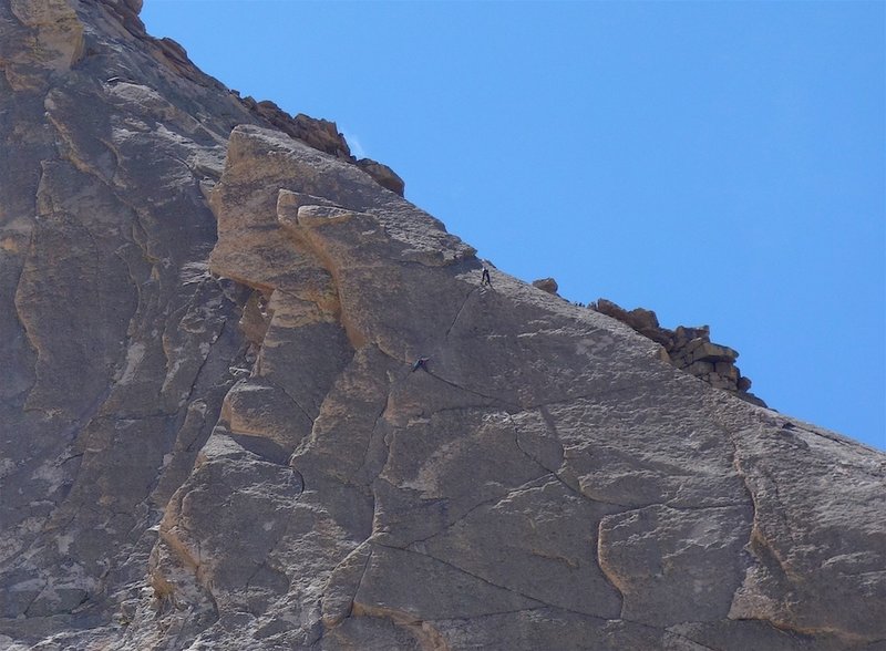 Climbers on the crux pitch of The Barb.