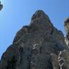 Mark Rafferty directly below the Ramp and piton crack on the first pitch of Spire One on his Picnic Traverse Day