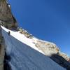 Heading across the snowfield on the first ledge.