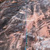 Does anyone know which route this is? Located near Kung Fu Theatre (a little further down the trail, and the start of the climb is on a ledge). Lots of chalk on the wall. Further up the wall there is a crack running up the wall.