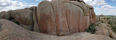 Panorama of the Jim Jam area. Jim Jam Junior is the left crack, Joke is the next one (close), Jim Jam is center, and Flare Thee Well is just right of center. Access comes from the slab on the right. You can downclimb from the top heading left.