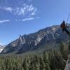 Scottish climber rapping, viewpoint from the anchors of P2