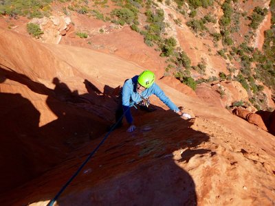 Blinded by the light, John Burcham tops out the second pitch on FA day.