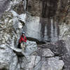 Conner Kranz on ledge before climbing the dihedral hand crack to pull the roof.