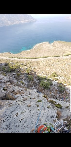 Looking back at the belay and down the face of Fes.