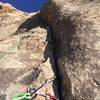 Bomber gear belay below the dihedral, after the traverse. would highly recommend skipping the bolted belay and settling down here instead. Less rope drag above, and no unprotected traversing for either party member!