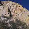 Looking up at first pitch. Yellow is P1. Blue is approximate P0 around the boulder and over the brush