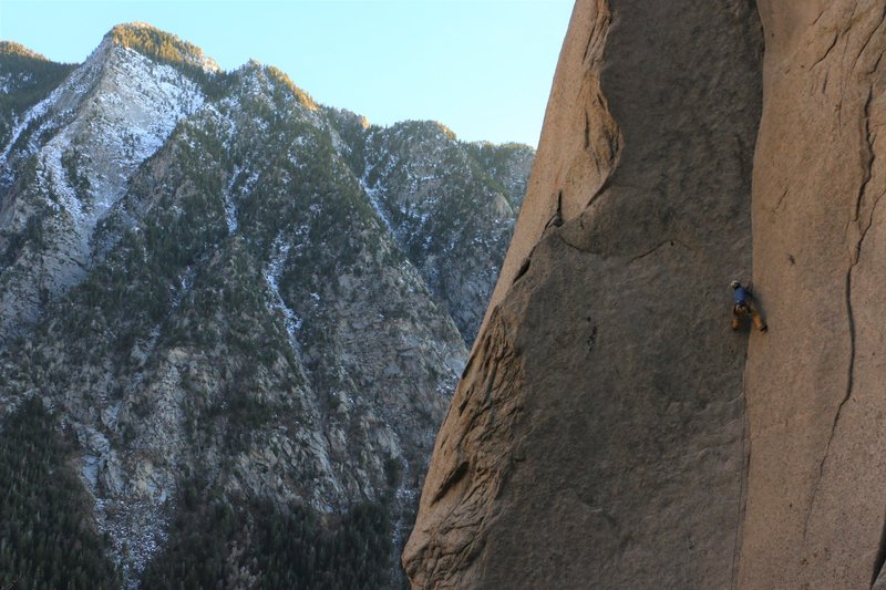 Keigan Tobin on lead about to hit the thin, reachy crux. Watch out for exfoliating rock on the right wall!