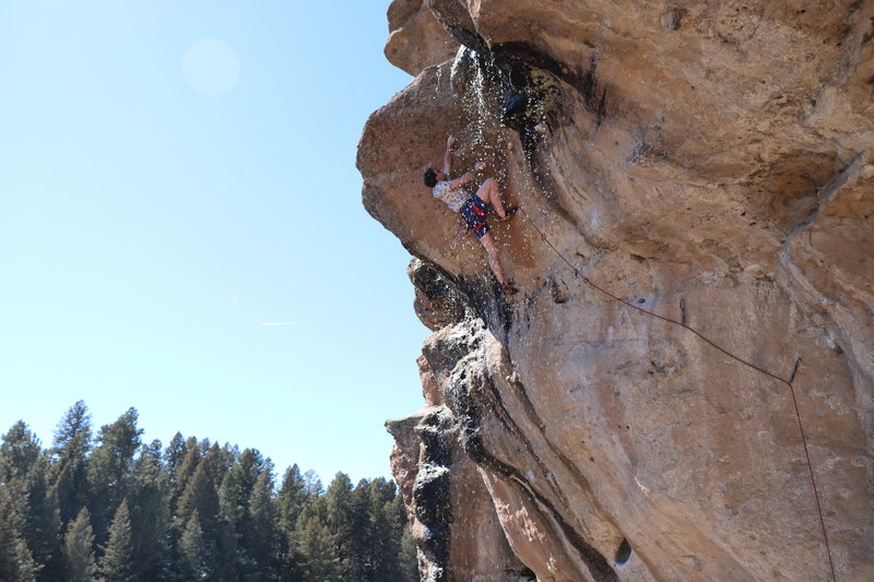 Traversing under the waterfall after a spring runoff. Naturally, only the crux cobble was wet.