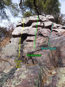 the Sun Spot wall.  These climbs start from the bench that separates the upper and lower halves of Dutchmans Rampart. Scramble up a groove below and left of Under the Pier to get here, or include the easy lower half of the rampart in your climb.