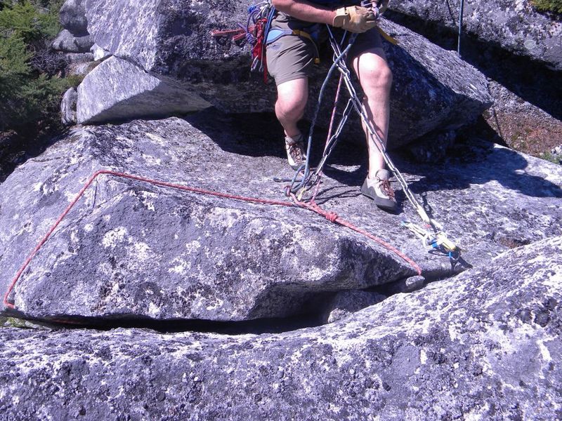 Getting ready to rap off the big rope sling on the summit.