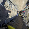 Climber coming up Crossing the Threshold