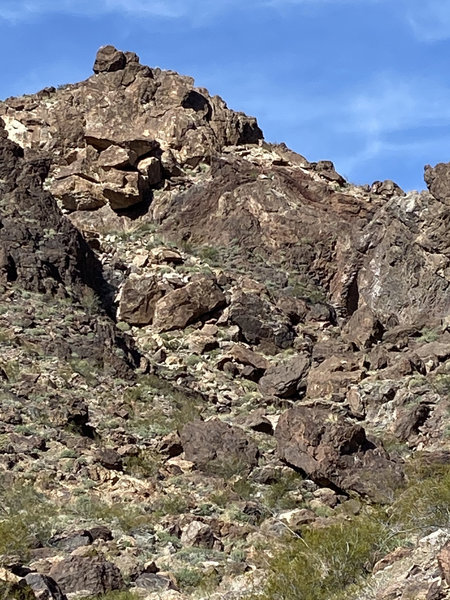 This view is looking north from the wash and shows most of the boulders at Purple Mine.