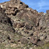 This view is looking north from the wash and shows most of the boulders at Purple Mine.