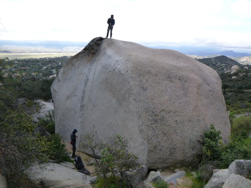 A view of the whole boulder.  5.7 slab to set up a TR is by the small tree on the right side of the picture.