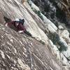 John Alberg staring down the 20 ft crux traverse back to the Sour Mash pitch 2 belay.