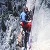 Dave Sessions belaying pitch 7.  (4th Ascent, May 1983)  Above Alan Nelson's homemade haulbag and wearing tennis shoes.